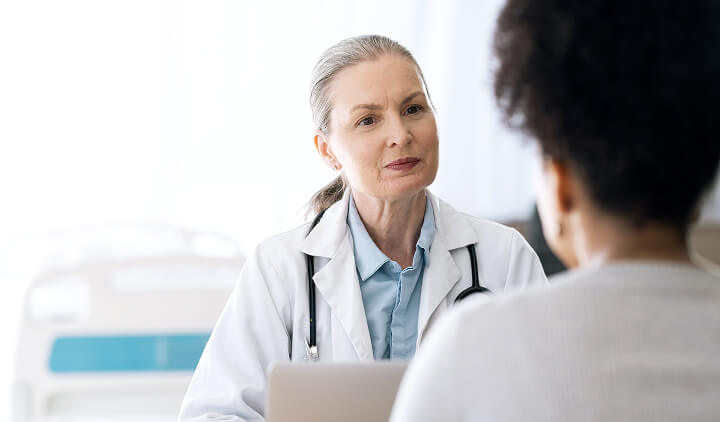 nurse speaking to patient
